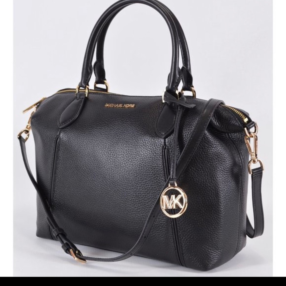 I’m selling a Large Black Michael Kors purse never used still in packaging.